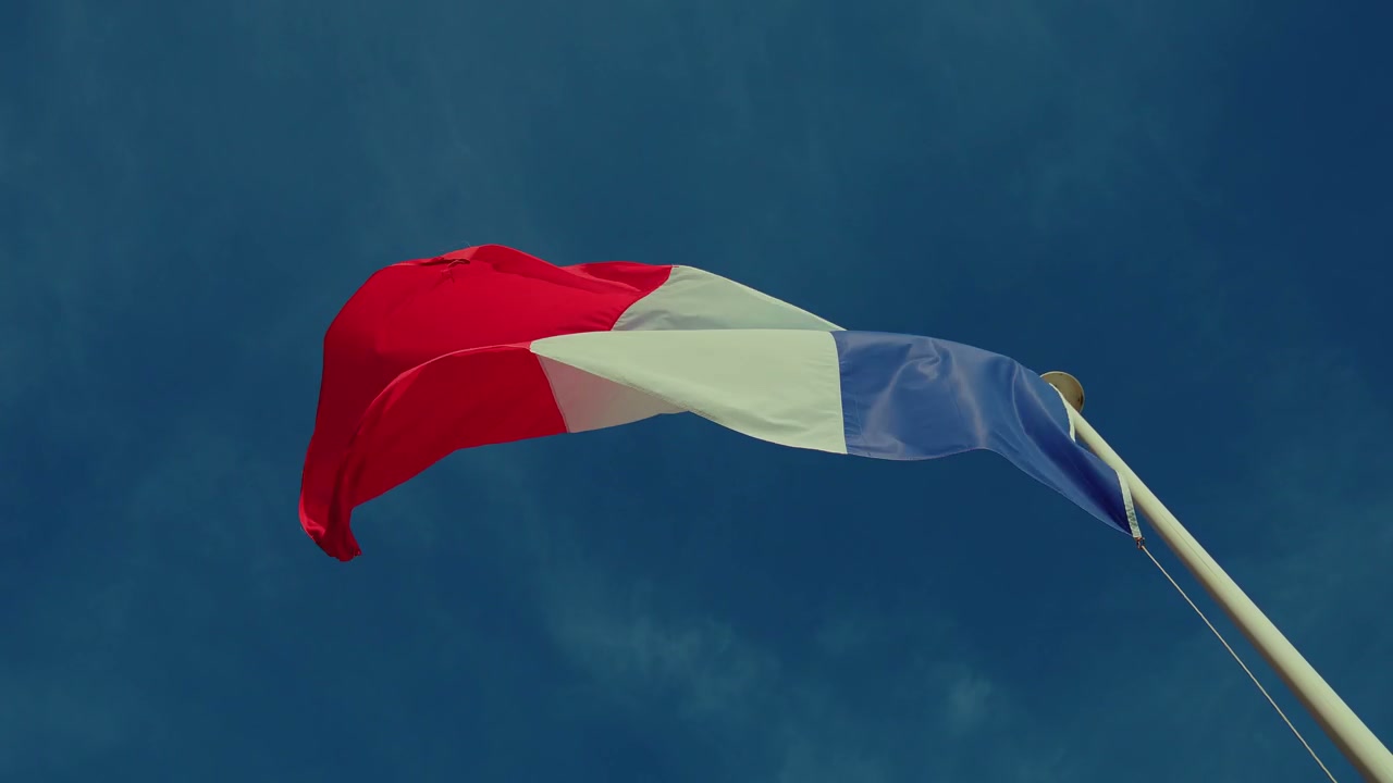 French Flag Waving in Blue Sky