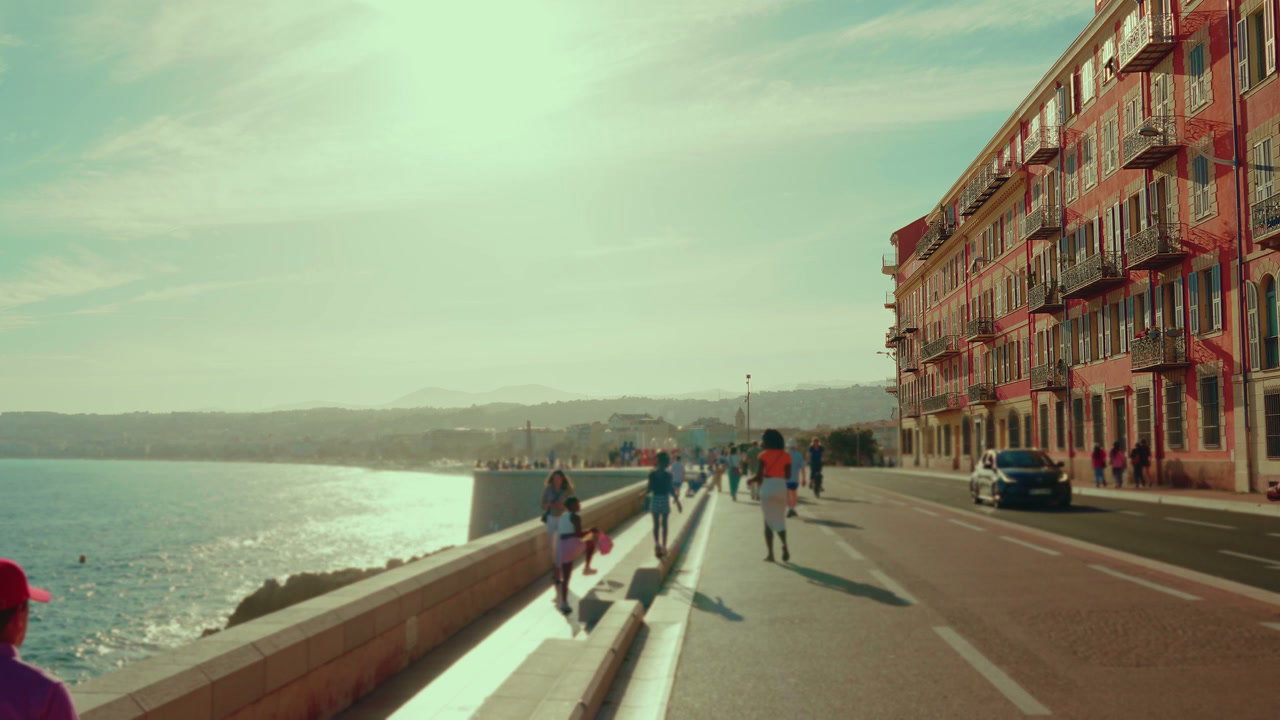 People Walking on Nice Coastal Promenade