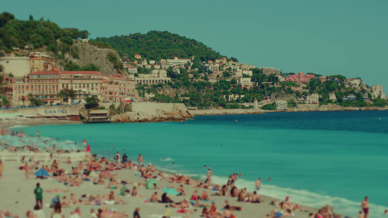 Crowded Beach and Cityscape in Nice