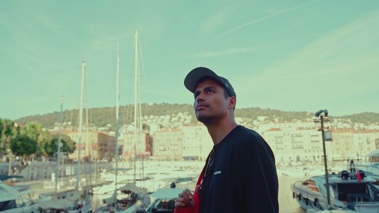 Man Looking at Boats in Nice Port