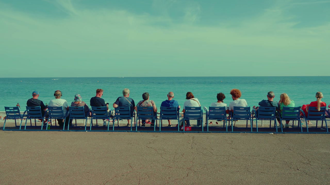 People on Promenade Watching Sea in Nice