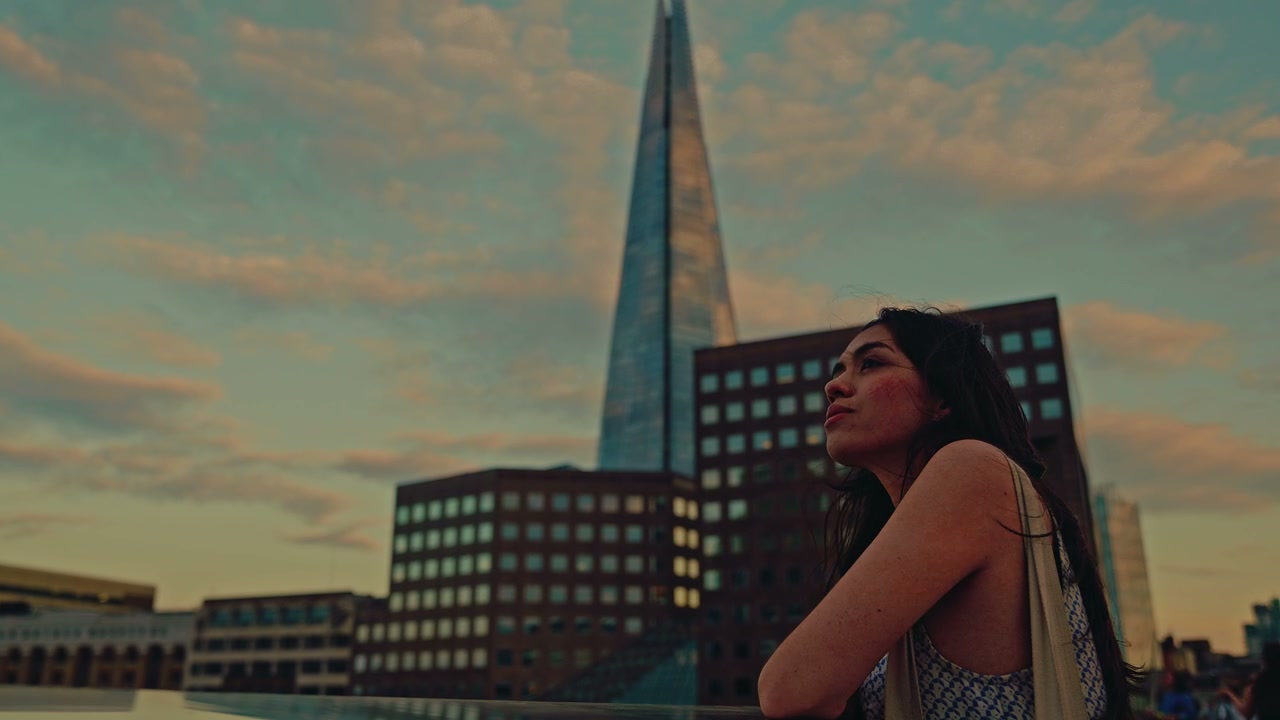 Woman Gazing at The Shard in London at Sunset