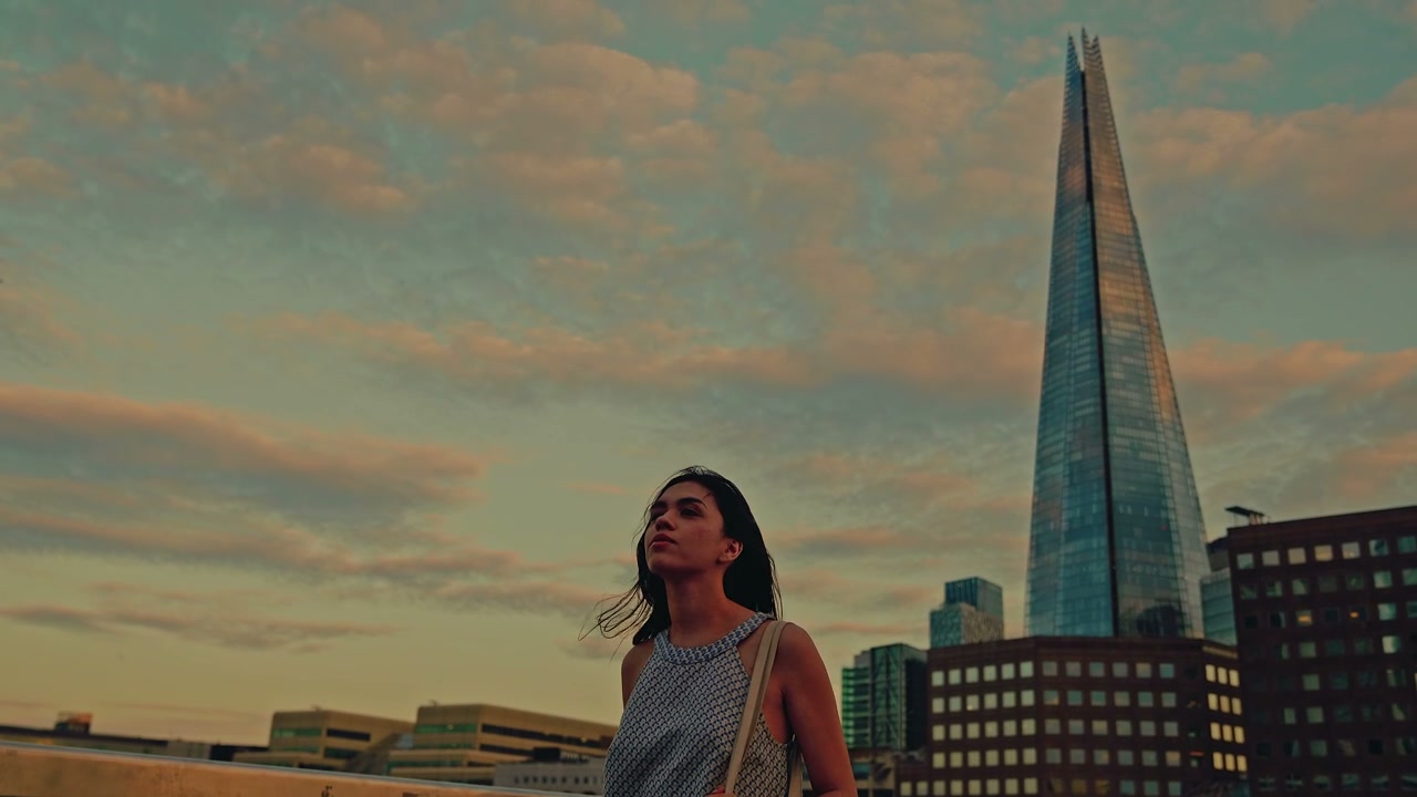 Woman Walking Past The Shard at Sunset
