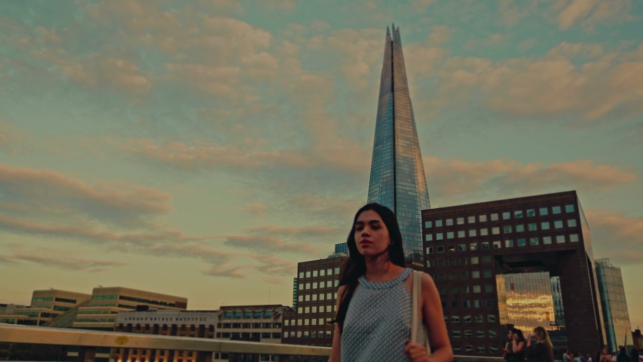 Woman Walking Near The Shard at Sunset