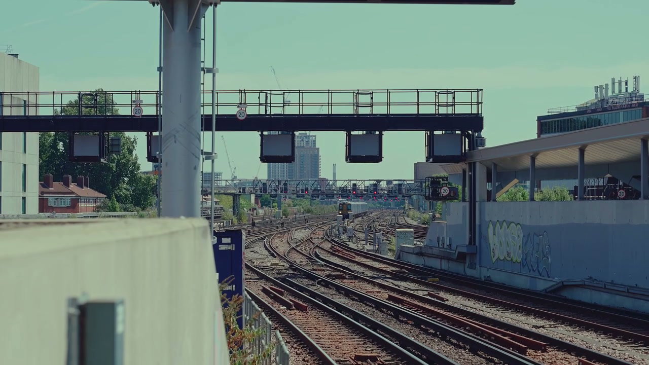 London Train Tracks with Distant Train