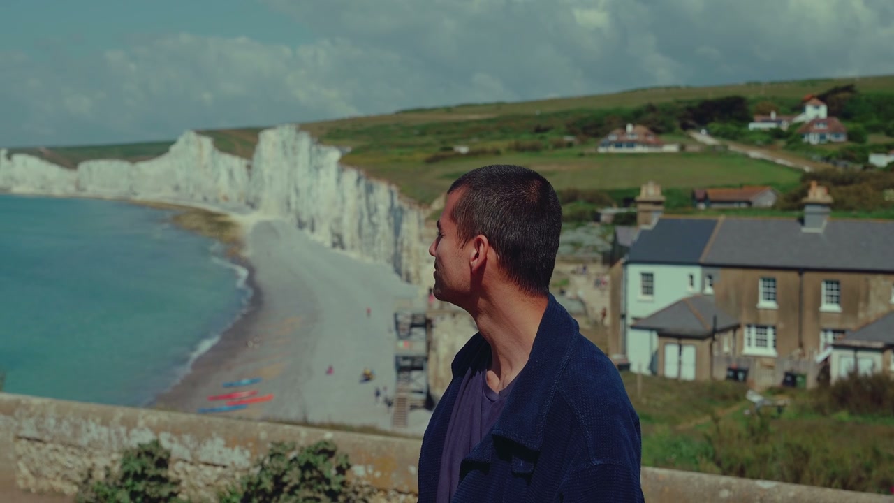 Person Looking Out at Seven Sisters Cliffs