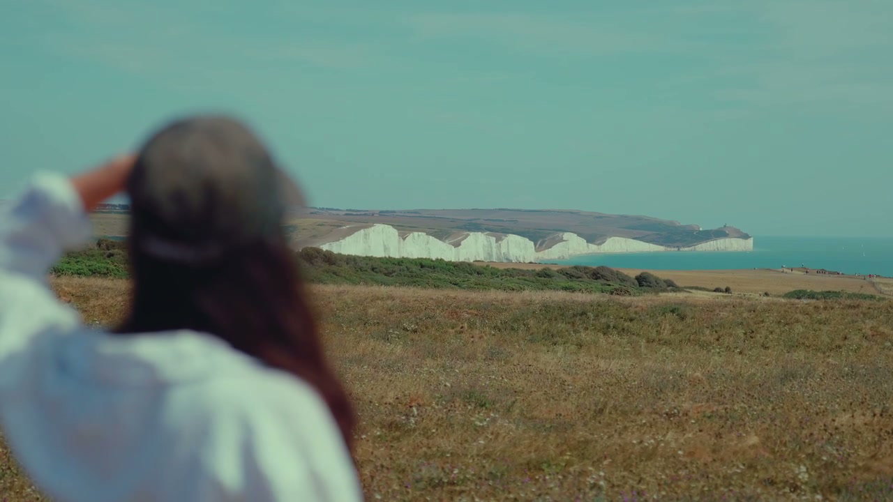 Person Looking at Seven Sisters Cliffs