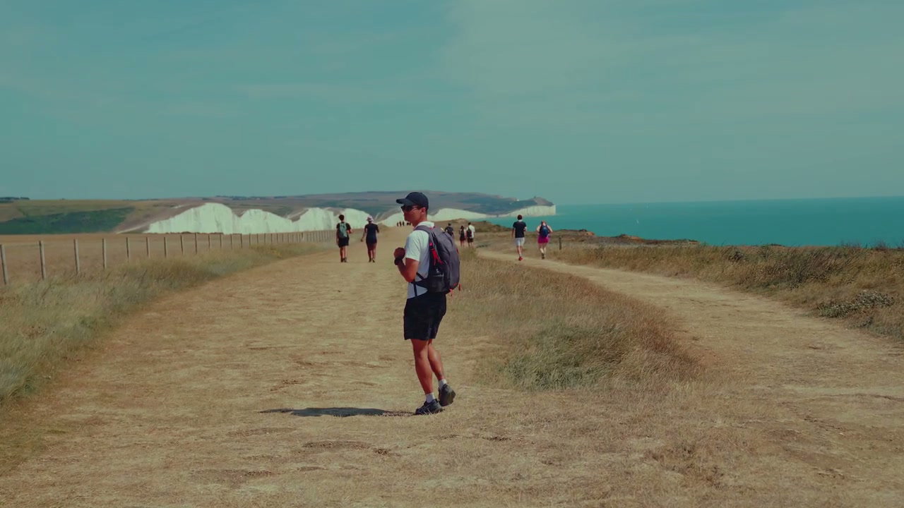 Hiker Walking on Seven Sisters Coastal Path