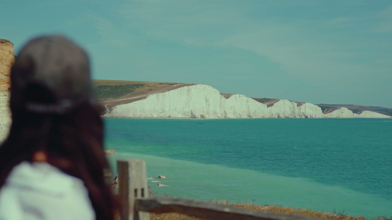 Person Looking Out at Seven Sisters Cliffs