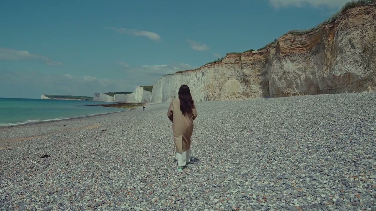 Person Walking on Seven Sisters Beach
