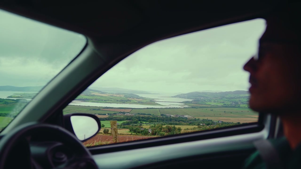 Driving Car Along Scenic Coastal Road