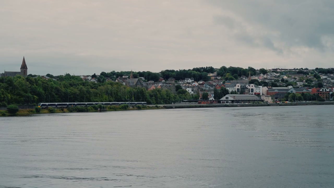Derry City Waterfront With Moving Train
