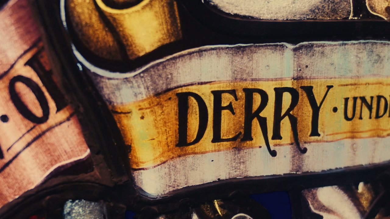 Ornate Stained Glass Window with Derry Text