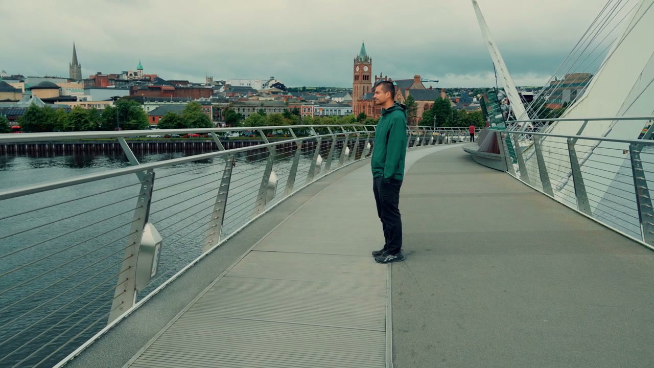Man Standing on Peace Bridge in Derry City