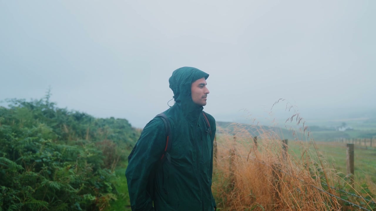 Man Hiking on Misty Coastline at Giant's Causeway