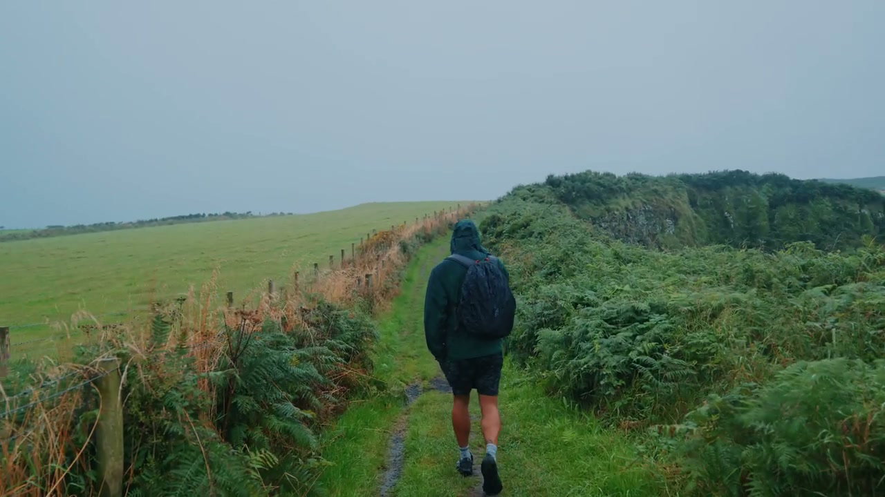 Hiker Walking Coastal Path, Giants Causeway