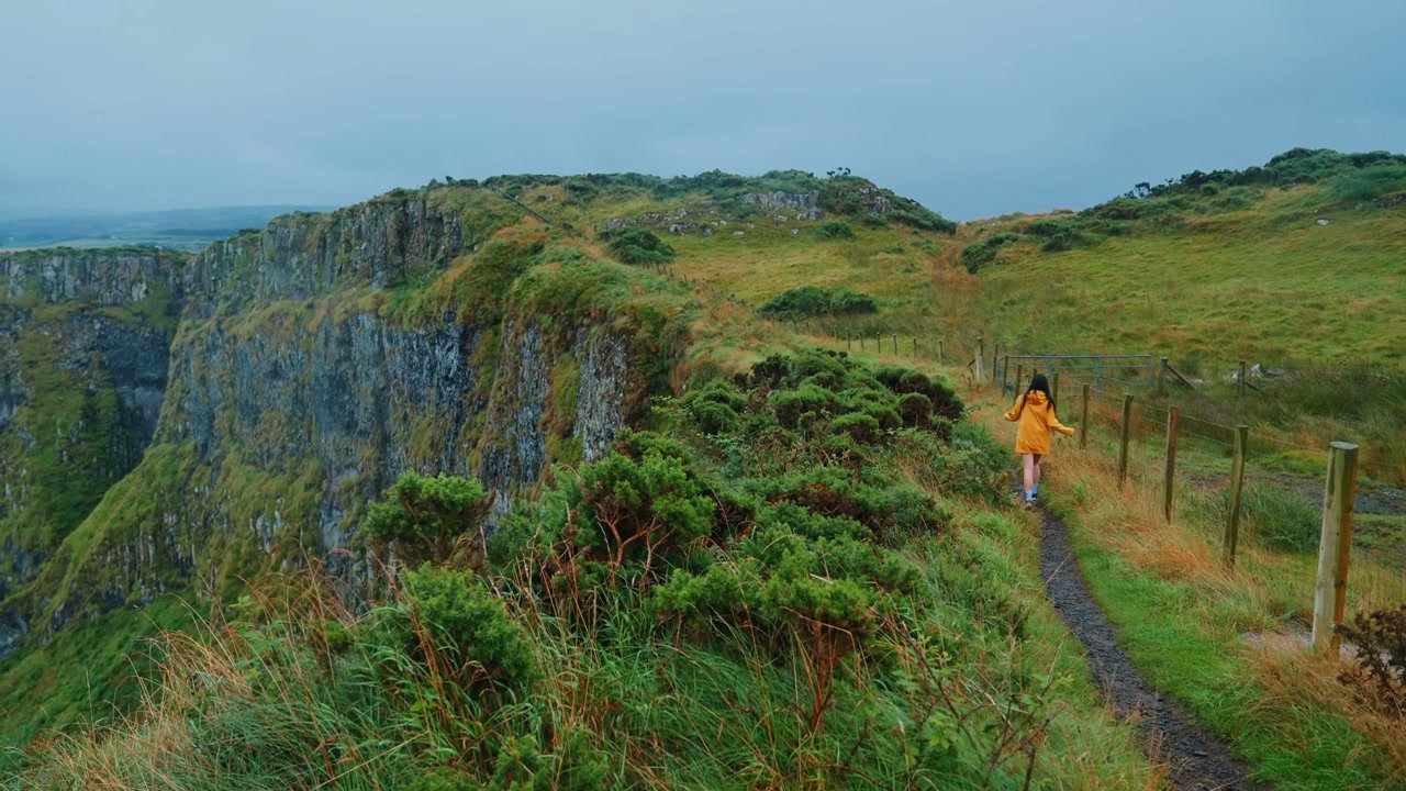 Person Walking Along Giants Causeway Cliff Path