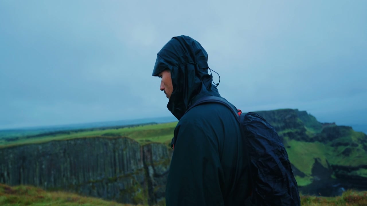 Hiker Walking on Giant's Causeway Cliffs