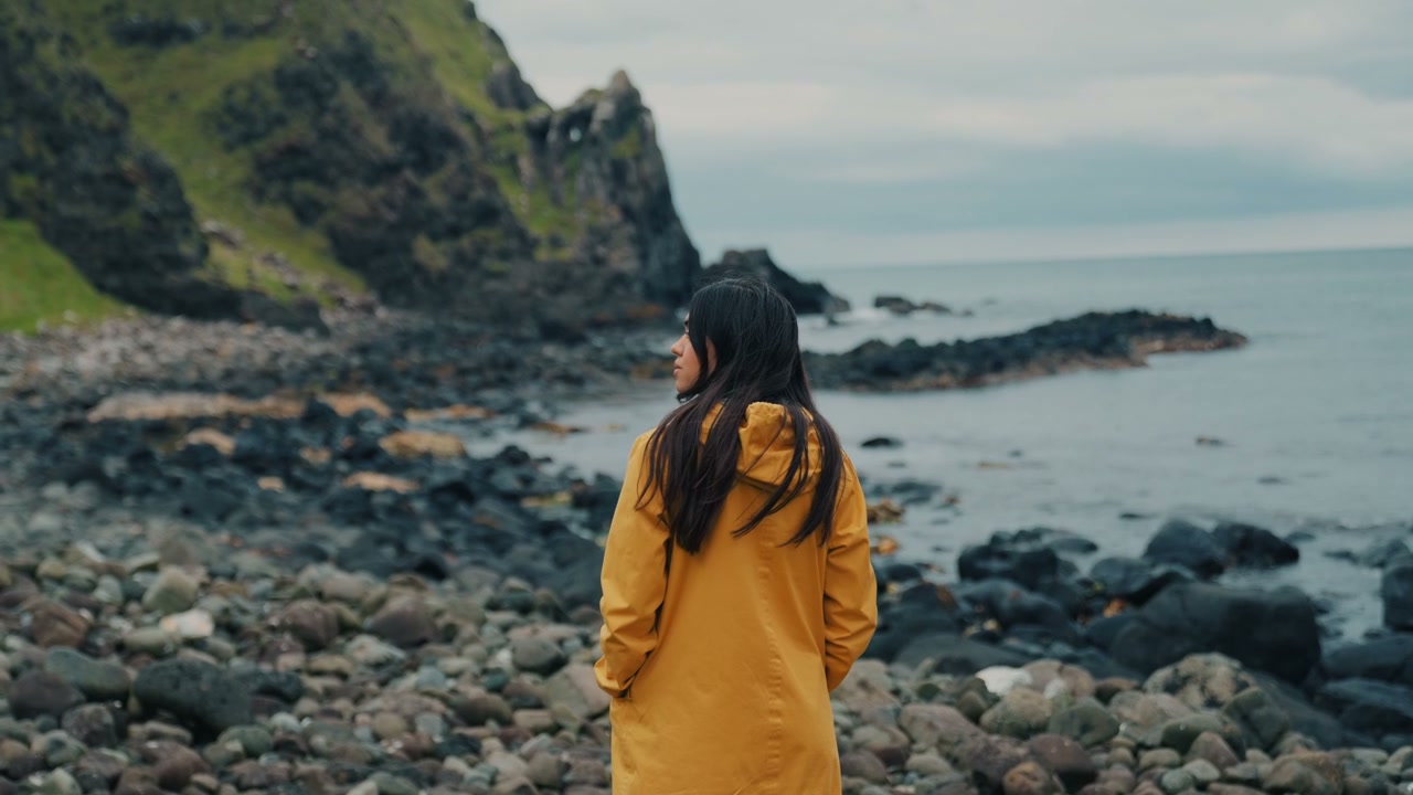 Woman on Rocky Coastline at Kinbane Castle