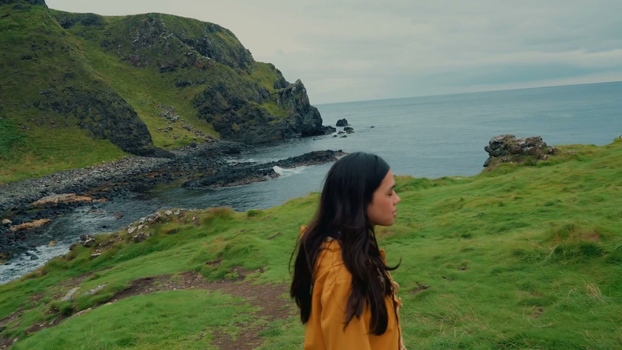 Woman Walking on Kinbane Castle Cliffs