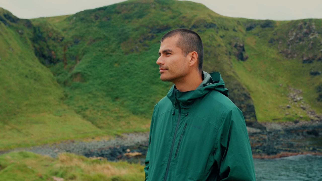 Man Gazing at Rugged Irish Coastline