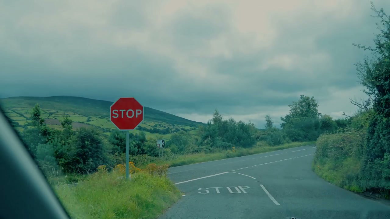 Driving Through Irish Countryside Past Stop Sign
