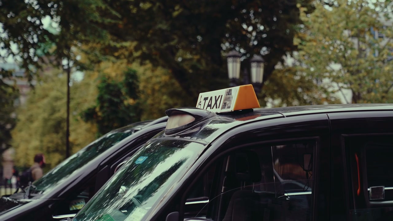 Black Taxi Cab with Illuminated Sign in Belfast