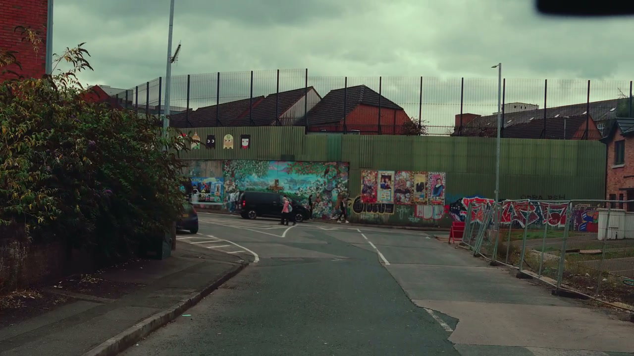 Belfast Street with Murals and Pedestrians