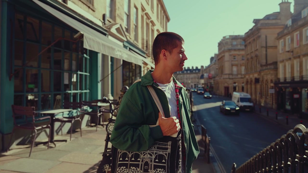 Young Man Standing on Sunny Bath City Street