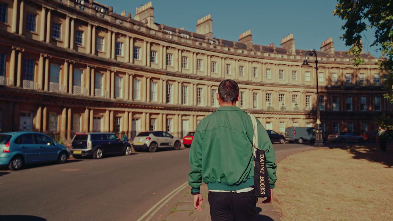 Man Walking By Historic Crescent in Bath