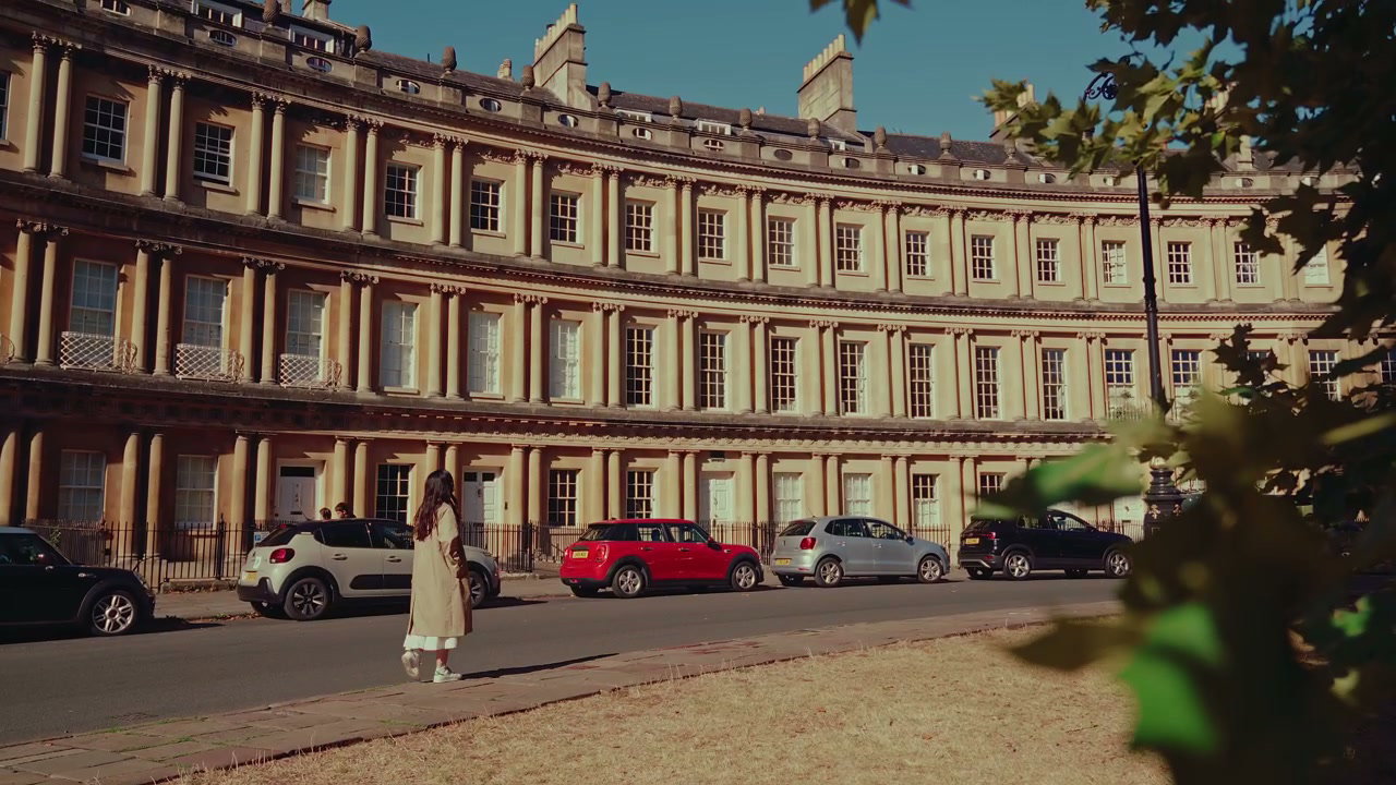 Woman Walking Past The Circus in Bath, England