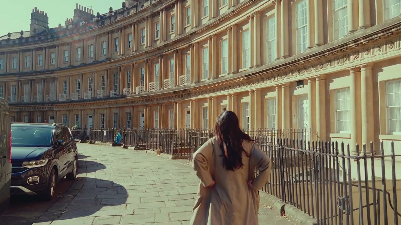 Woman Walking Along Royal Crescent in Bath