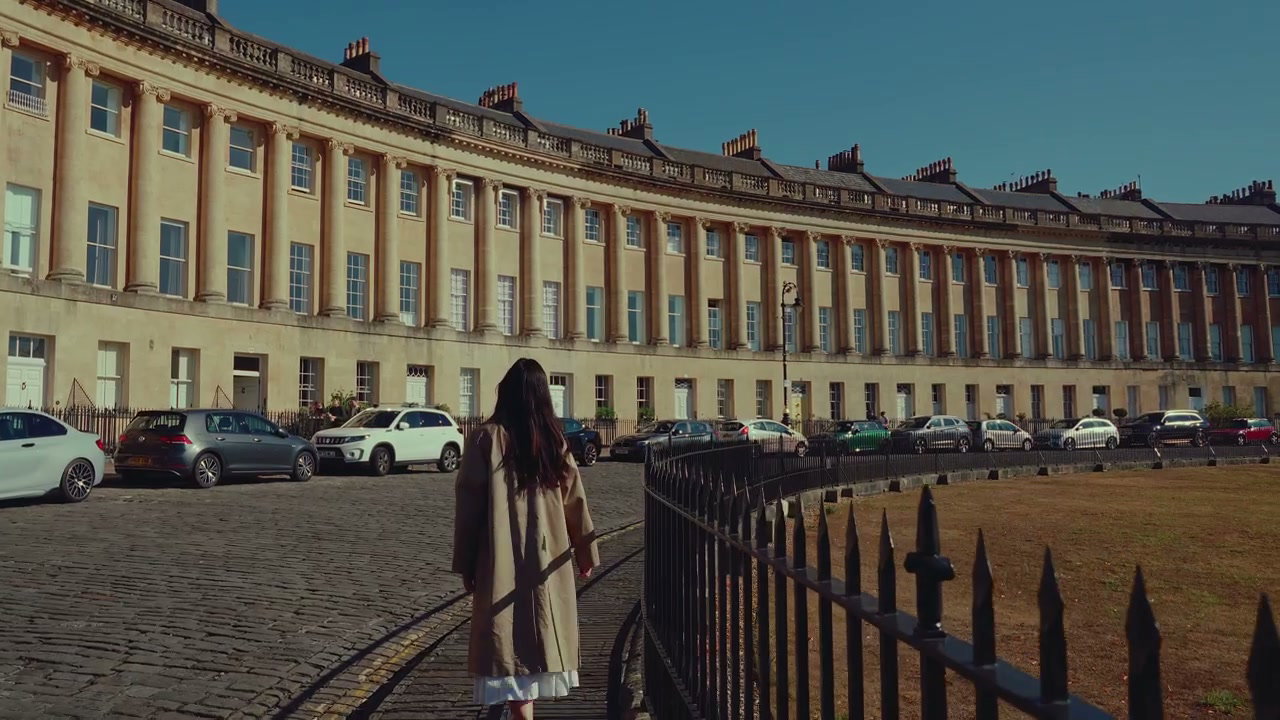Woman Walking By Royal Crescent in Bath, England