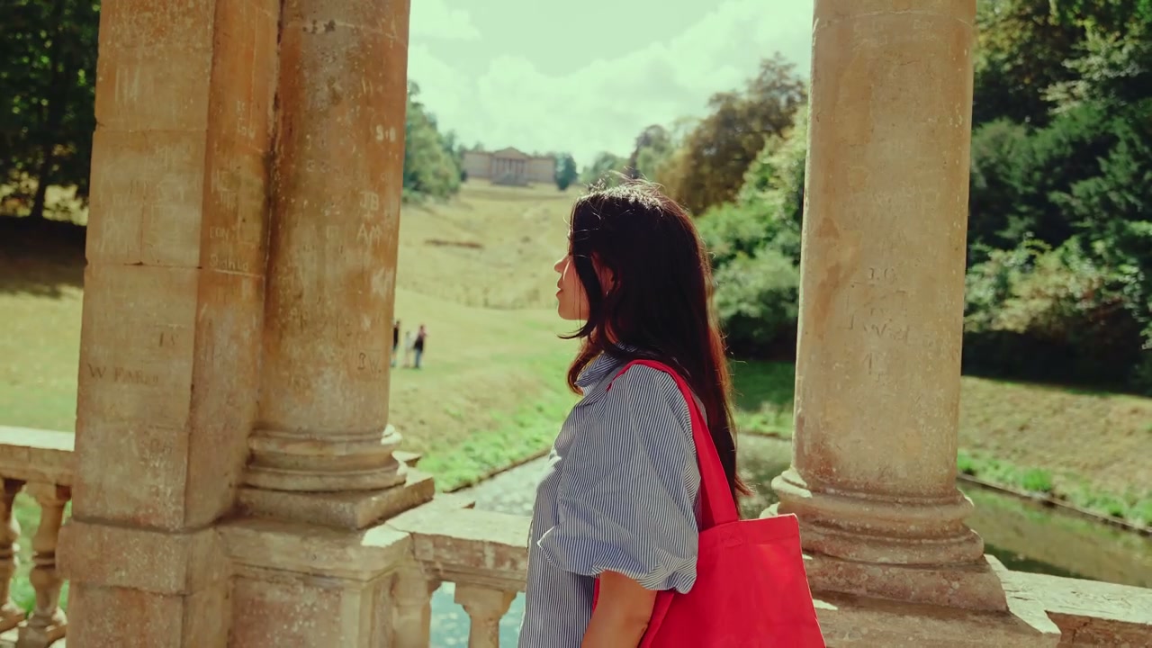 Woman Walking in Historic Garden in Bath