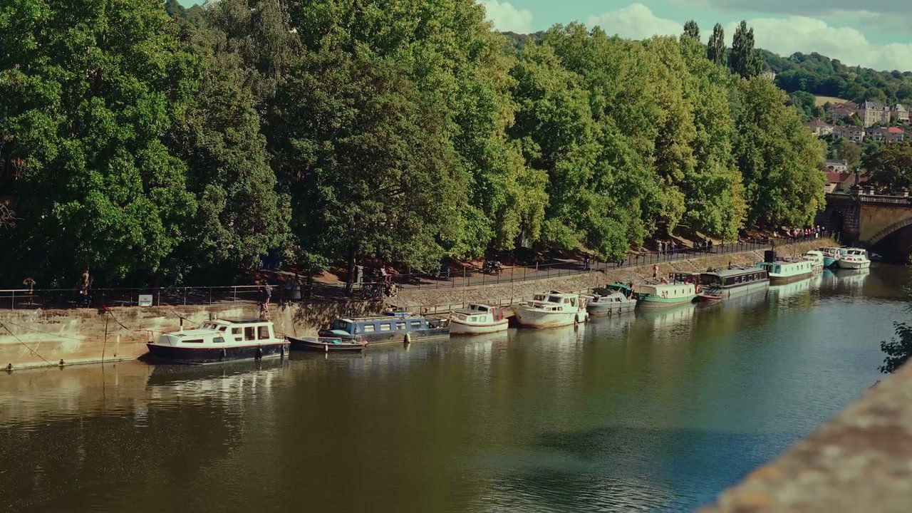 Canal Boats Moored on River in Bath, England