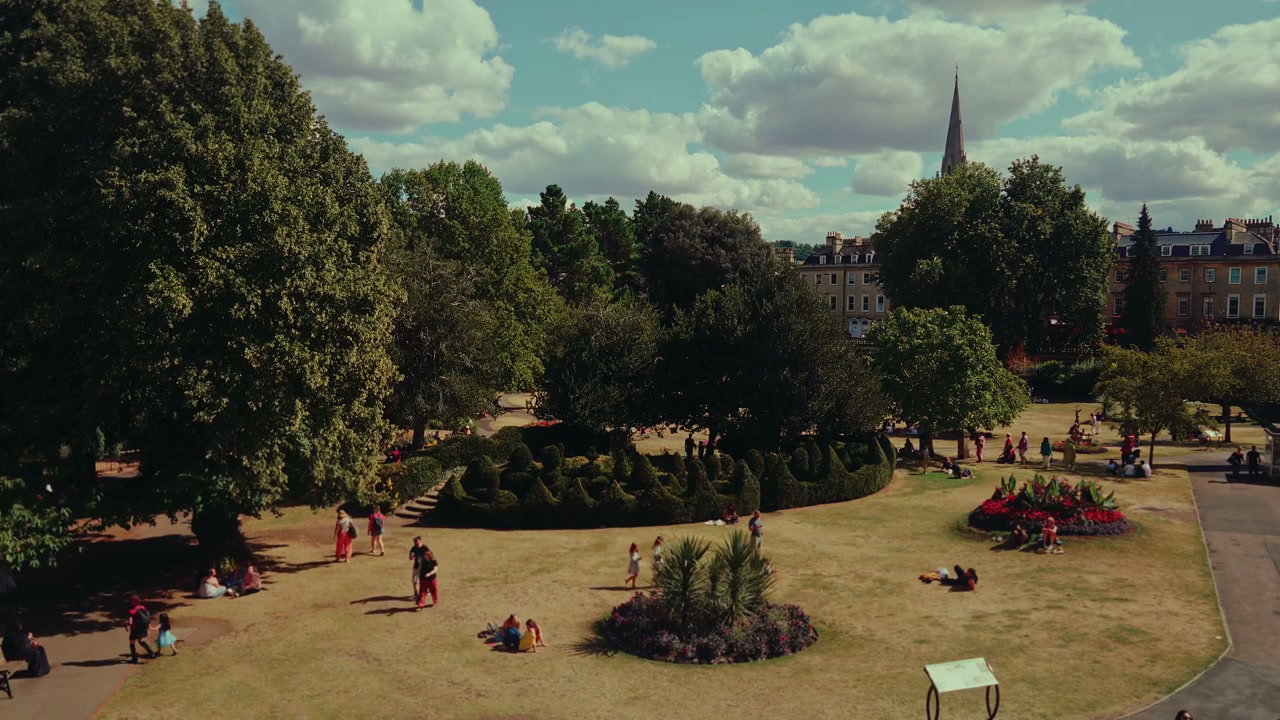 People Relaxing in a Sunny City Park, Bath