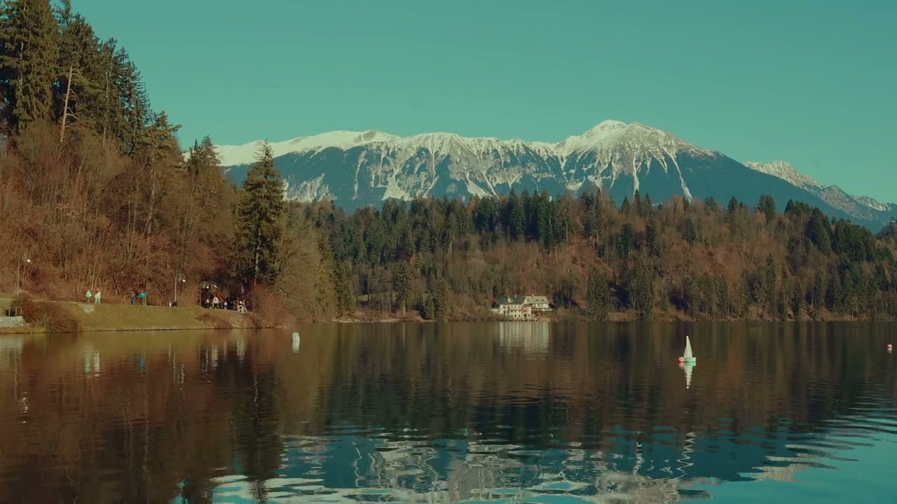 Lake Bled Shore with Snow-capped Mountains