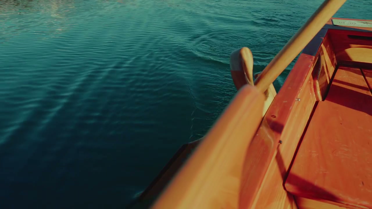Rowboat Oar Paddling in Blue Lake Water