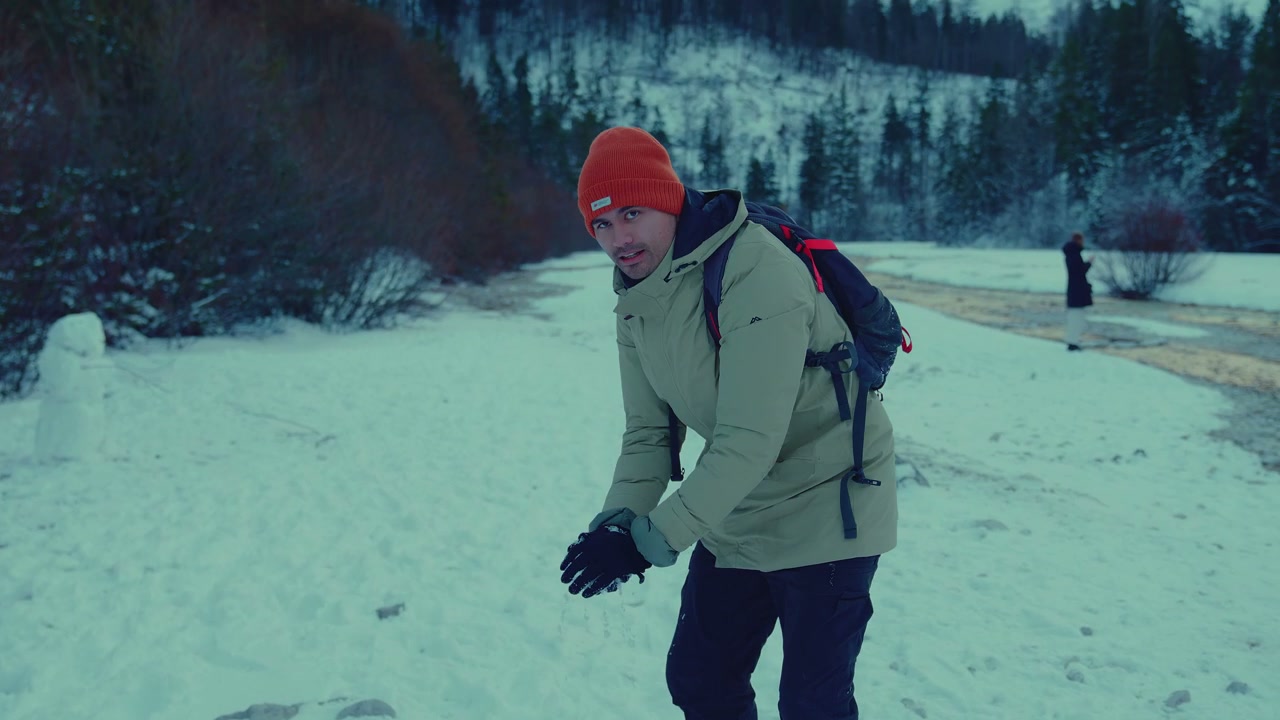Man Throws Snowball at Lake Jasna