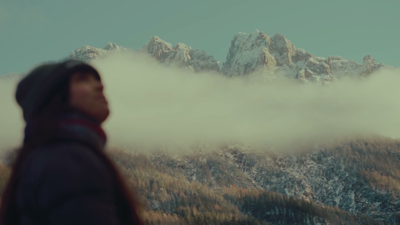 Snowy Mountain Peaks With Passing Clouds