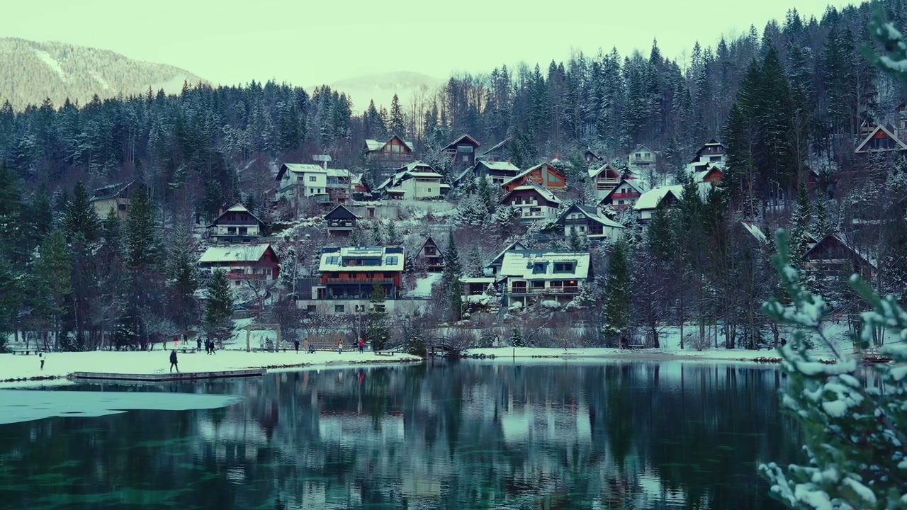 Snowy Village Reflected in Lake Jasna