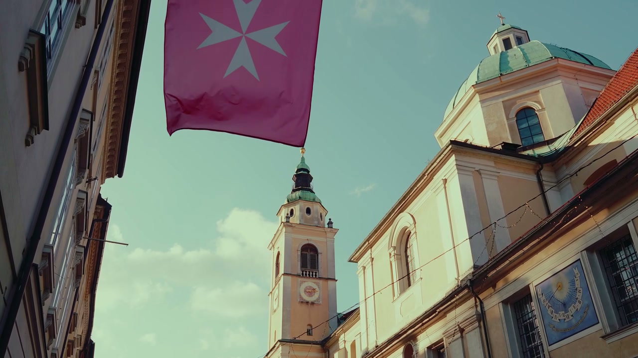 Ljubljana Church Tower with Waving Flag