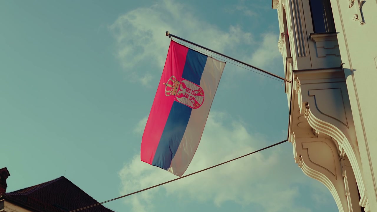 Serbian Flag Waving From Building