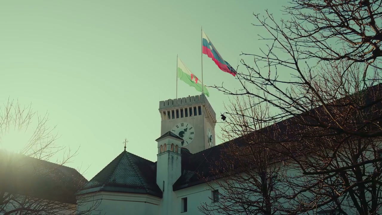 Ljubljana Castle Flags Waving on Clock Tower