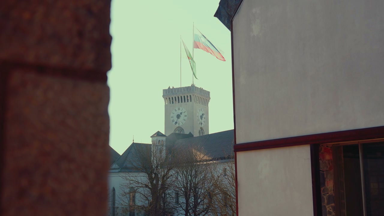 Ljubljana Castle Tower with Flags Waving