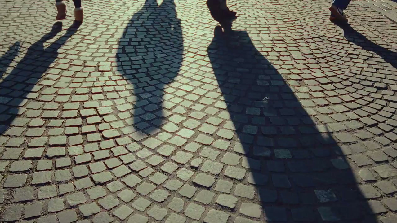 Pedestrians Walking on Ljubljana Cobblestone Street