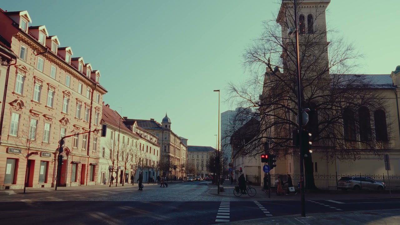 Ljubljana City Street with Church and Pedestrians