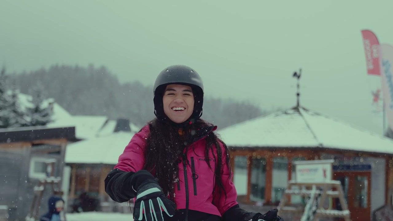 Smiling Woman Playing in Snow