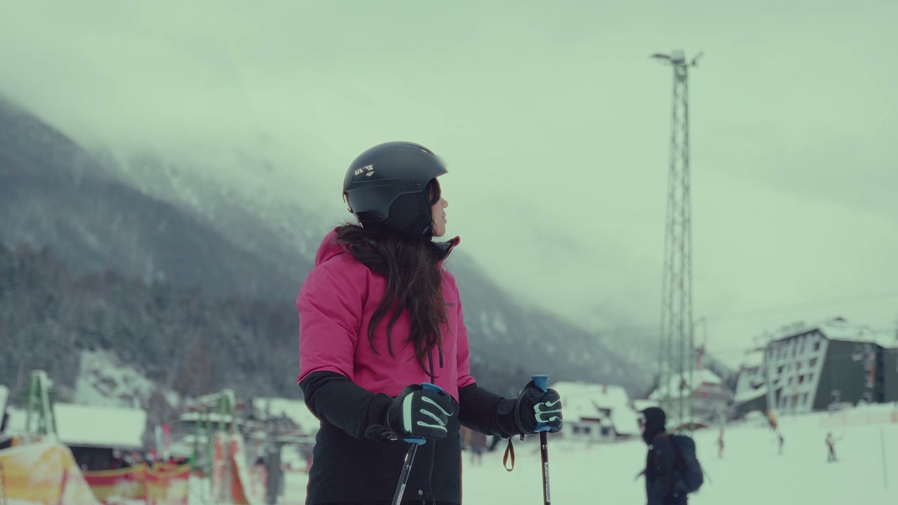 Skier Looking Around at Mountain Resort