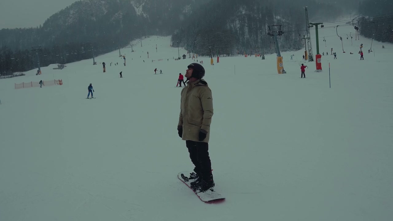 Snowboarder Falling on Snowy Ski Slope